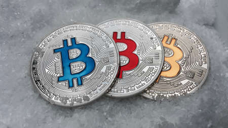 Digital currency physical metal coin on the white cristal background. Virtual cash concept.の写真素材