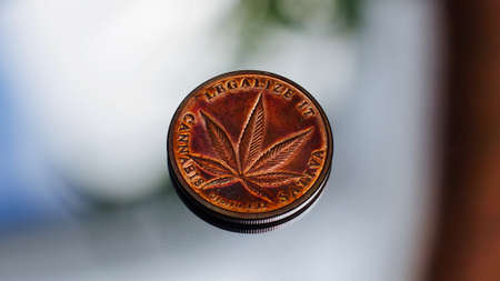 Brass marijuana coin. Legalize it. Sativia. Coin with cannabis leaf.の写真素材