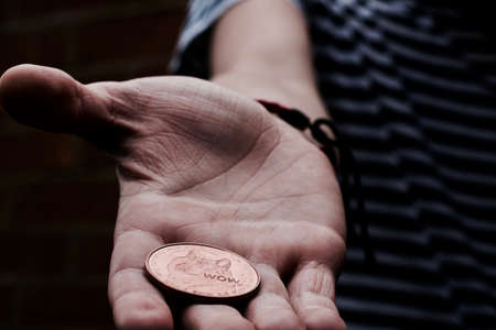 Digital currency physical brass dogecoin coin. Virtual cash concept.の写真素材