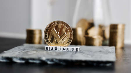 Digital currency physical metal litecoin coin near business white letters inscription.の写真素材