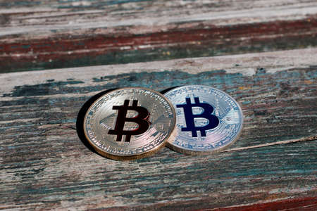 Digital currency physical gold red bitcoin coin. Outdoor money concept.の写真素材