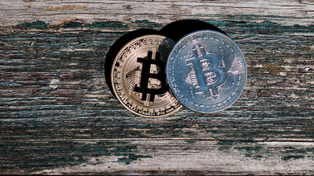 Digital currency physical gold red bitcoin coin. Outdoor money concept.の写真素材
