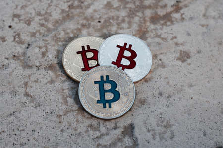 Digital currency physical gold red bitcoin coin. Outdoor money concept.の写真素材