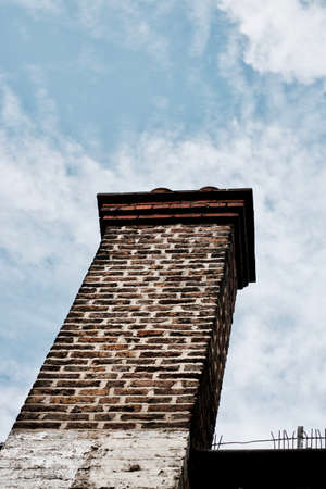 Small brick chimney on the house in London. Old building.の写真素材