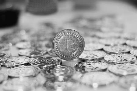 Digital currency physical metal bitcoin coin on the gold bitcoins. Gold money concept.の写真素材