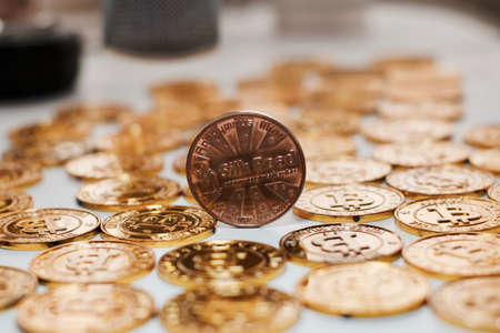 Digital currency physical metal bitcoin coin on the gold bitcoins. Gold money concept.の写真素材