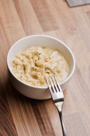 Delicious and fresh italian food. Pasta with cheese in the kitchen. Food concept.の写真素材