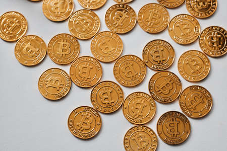 Digital currency physical gold bitcoin coin on the white background. Money concept.の写真素材