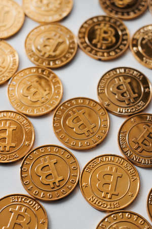 Digital currency physical gold bitcoin coin on the white background. Money concept.の写真素材