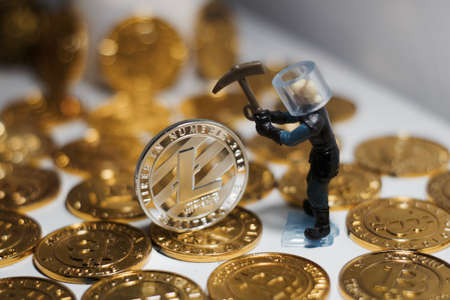 Digital currency physical metal litecoin coin near bitcoin coins. Money concept.の写真素材