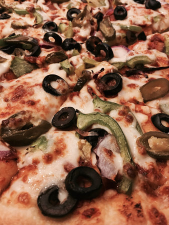 Delicious and fresh italian pizza with vegetables, jalapeno and pepperoni.