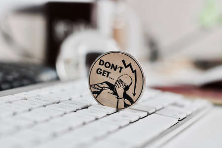 Digital currency physical metal bitcoin coin on the white keyboard near glass ball.の写真素材