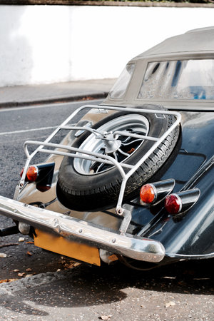Black old classic car on the road in Richmond, Londonの写真素材