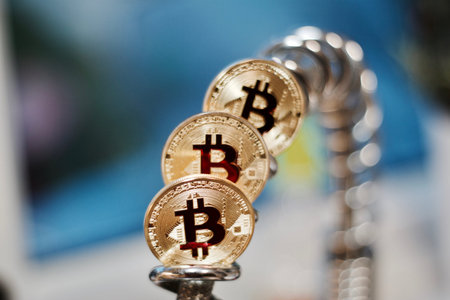 Digital currency physical metal bitcoin coin. Cryptocurrency cash concept.