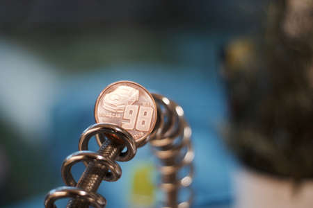 Digital currency physical brass dogecoin coin. Cryptocurrency mining concept.の写真素材