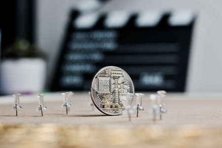 Digital currency physical metal bitcoin coin. Cryptocurrency cinema concept.の写真素材