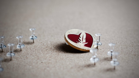 Digital currency physical gold feather coin. Office cryptocurrency concept.の写真素材