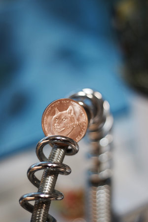 Digital currency physical brass dogecoin coin. Cryptocurrency mining concept.の写真素材