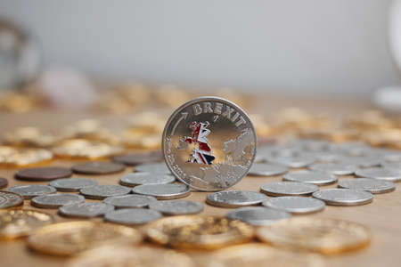 Physical metal silver brexit coin with British map on the front. Europe leaving. Article 50.の写真素材