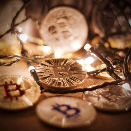 Digital currency physical metal bitcoin coin. Christmas cryptocurrency concept.の写真素材