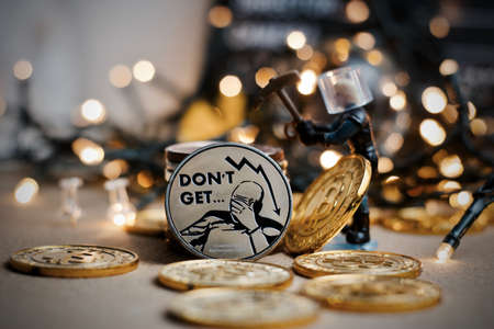 Digital currency physical metal coin. Christmas cryptocurrency concept.の写真素材