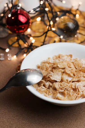 Delicious and fresh corn flakes in white bowl. Christmas food concept.の写真素材