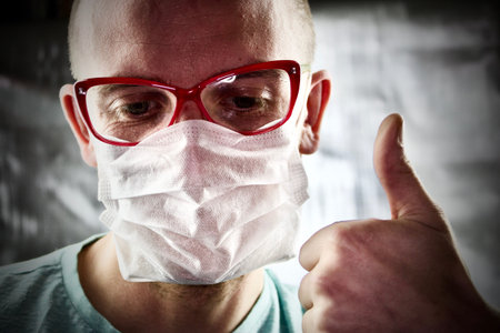 Young white doctor in pink glasses on head. Medical photo concept.の写真素材