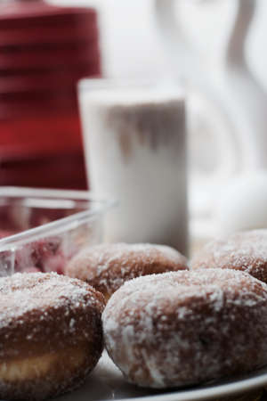 Delicious doughnuts on the white plate. Sweet fresh food concept.の写真素材