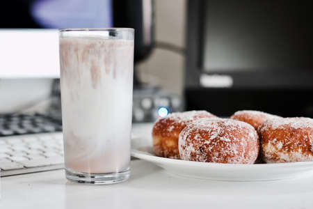 Delicious doughnuts on the white plate. Sweet fresh food concept.の写真素材
