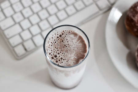 Fresh and delicious chocolate milk in glass. Office food concept.の写真素材