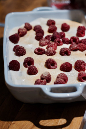 Delicious and fresh home made tiramisu with raspberry. Sweet food concept.