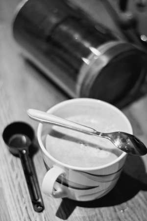Fresh and tasty coffee in the kitchen on the wooden board. Drink concept.の写真素材