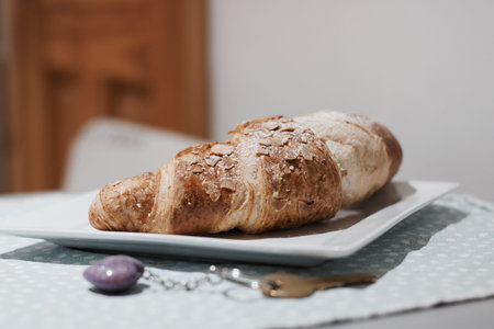 Delicious and fresh crossaint in the kitchen. Sweet food concept.