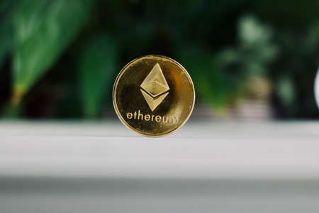 Digital currency physical ethereum coin. Cryptocurrency concept.の写真素材
