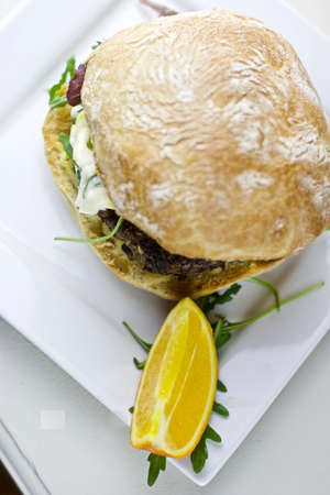 Tasty fresh vegetarian burger on a white plate. Fast food concept.の写真素材