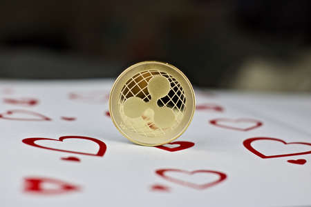 Digital currency physical metal ripple love coin. Valentines Day backgroundの写真素材
