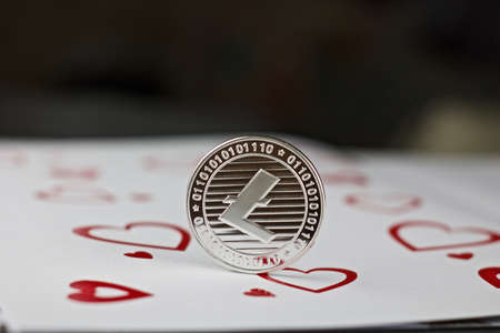 Digital currency physical metal litecoin coin. Love scene background.の写真素材