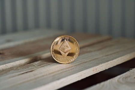 Digital currency physical ethereum coin. Cryptocurrency concept.の写真素材