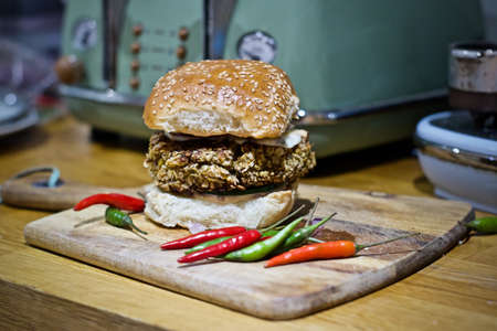Delicious and fresh hot vegetarian burger with peppers. Bean concept.の写真素材