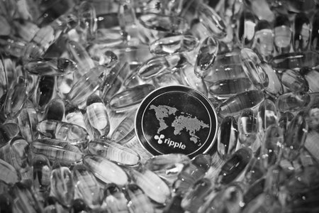 Digital currency physical metal ripple coin. Cryptocurrency drugs concept.の写真素材