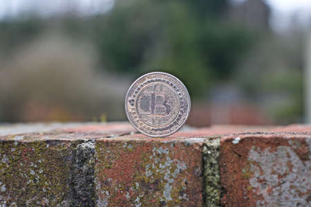 Digital currency physical metal bitcoin coin. Cryptocurrency outdoor concept.の写真素材