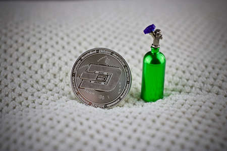 Digital currency physical metal silver dashcoin coin. Cryptocurrency dashcoin concept.の写真素材