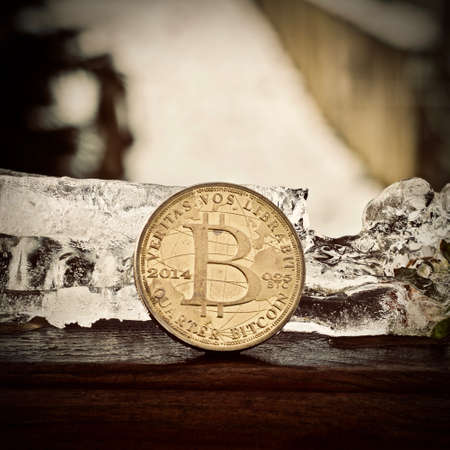 Digital currency physical metal bitcoin coin. Cryptocurrency ice concept.の写真素材