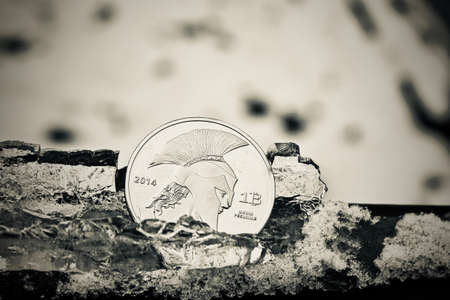 Digital currency physical metal bitcoin coin. Cryptocurrency ice concept.の写真素材