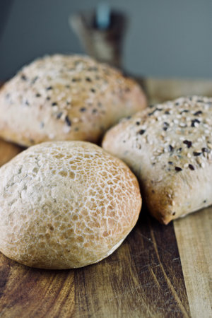Fresh and tasty seeds rolls in the kitchen. Food concept.
