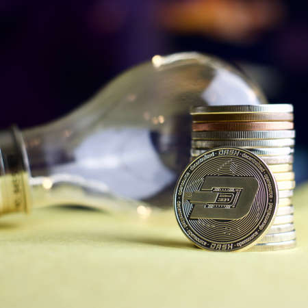 Digital currency physical metal silver dashcoin coin. Cryptocurrency concept.の写真素材