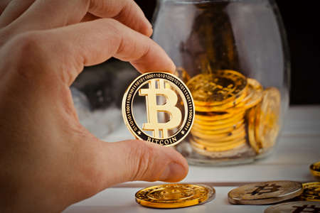 Digital currency physical metal bitcoin coin. Cryptocurrency savings concept.の写真素材