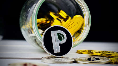 Digital currency physical metal silver peercoin coin. Cryptocurrency gold conceptの写真素材