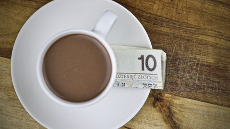 Paper polish currency and coffee. Polish money concept.の写真素材