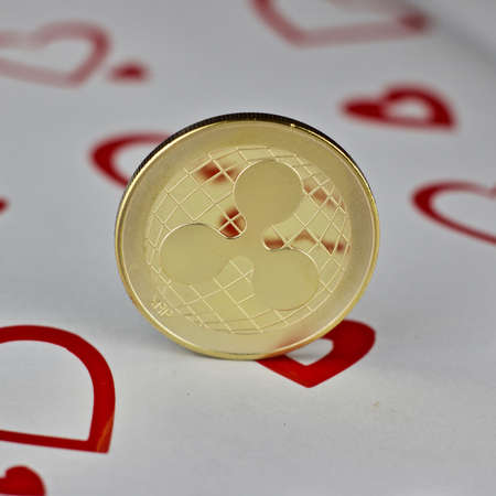 Digital currency physical metal ripple love coin. Valentines Day backgroundの写真素材
